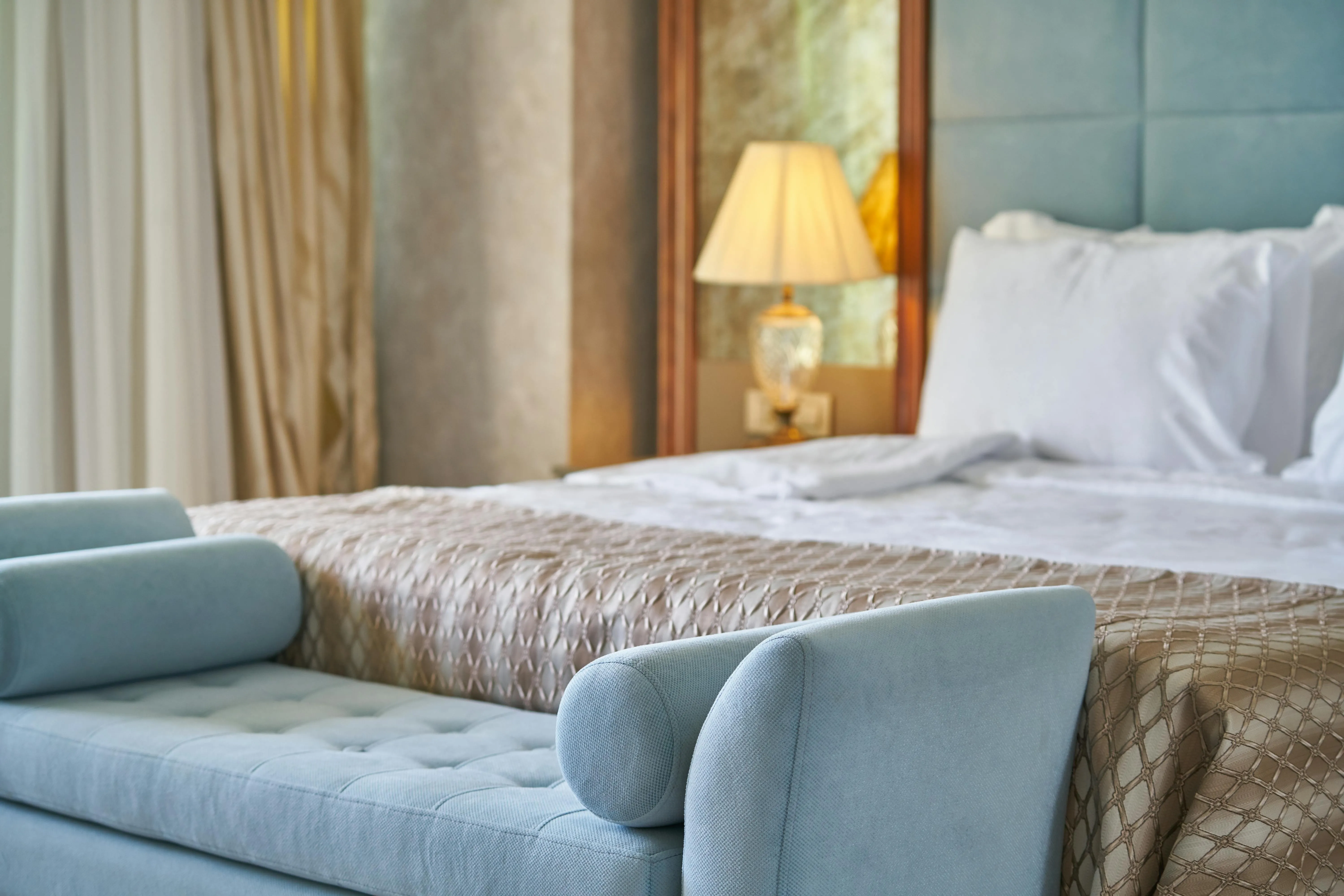 Picture of a hotel room bed.